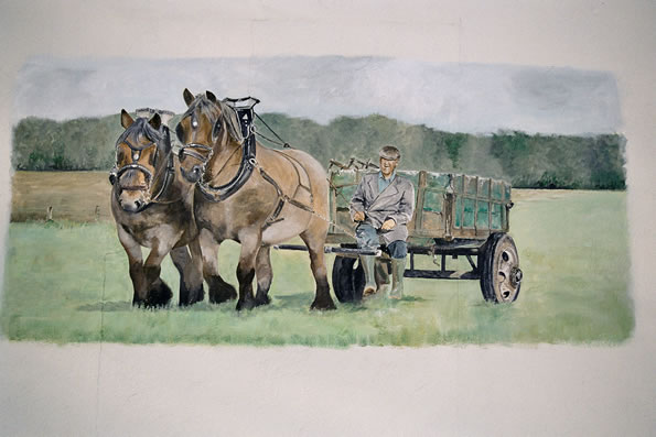 Bauer mit Pferdewagen